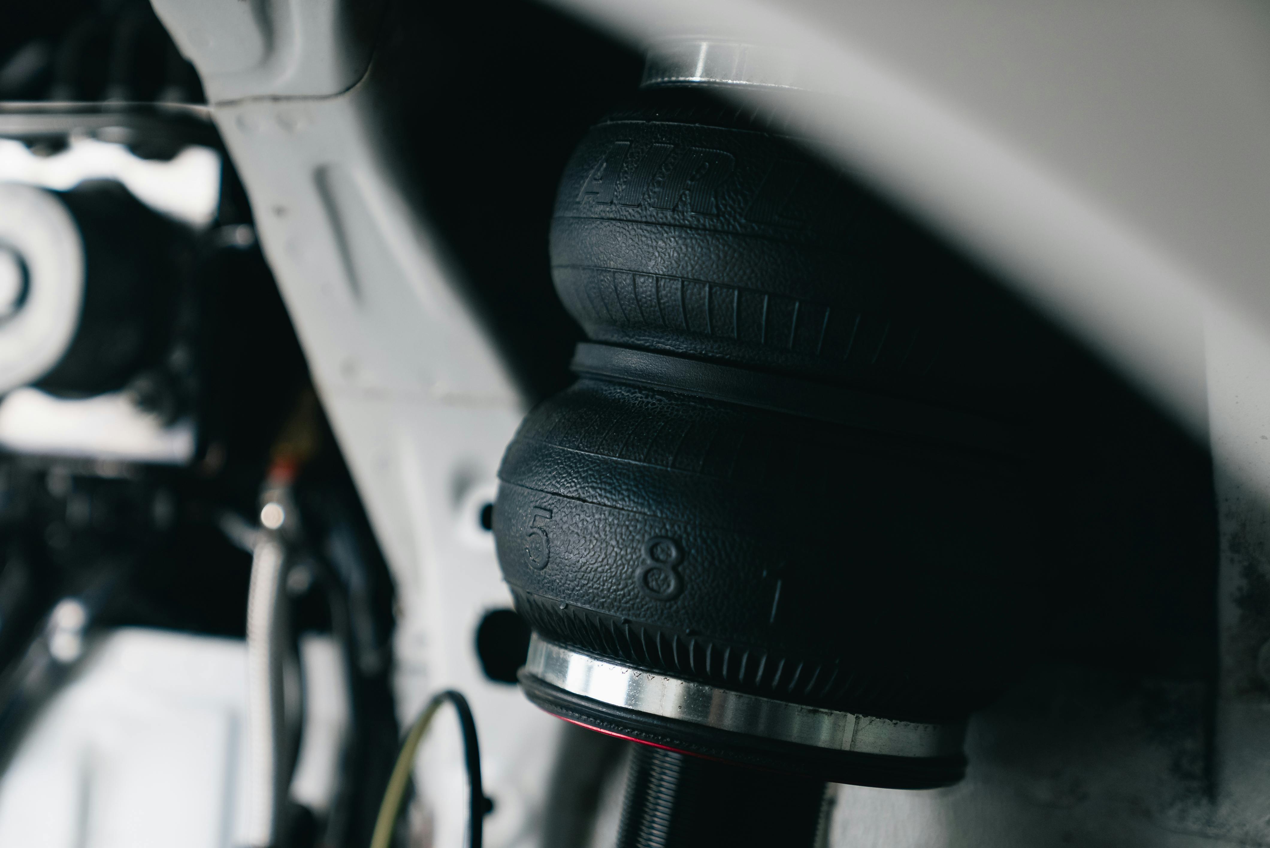 Suspension control arms and steering racks